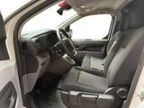the interior of a white truck with the door open