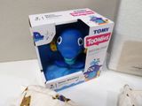a blue toy that is in a box on a table
