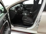 the interior of a car with the door open and the driver ' s seat down