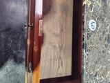 a wooden cabinet with a door open on the floor