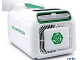 a white and green air conditioner on a white background