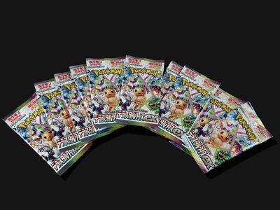 a lot of pokemon trading cards on a black background