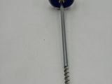 a close up of a metal screw with a blue handle on a white surface