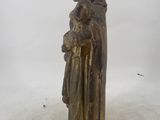 a statue of a woman holding a child in her arms