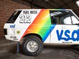 a van with a rainbow painted on the side of it