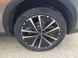 a close up of a tire on a car ' s rim
