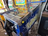 a pinball machine that is sitting in a room