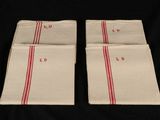 two red and white napkins on a black background