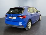the rear end of a blue car parked in a garage