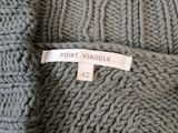 a close up of a sweater with a label on it