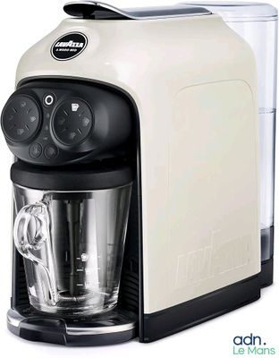a coffee maker that is sitting on a white surface