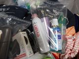 a basket full of cleaning products and other household items