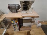 a desk with a computer and a mixer on top of it