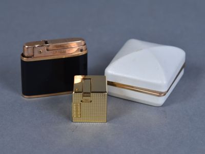 two lighters sitting next to each other on a table