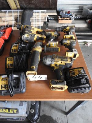 many different tools on a table in a garage