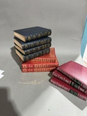 four books stacked on top of each other on a table