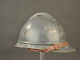 a helmet that is sitting on a stand on a table