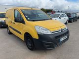 yellow citrole van parked in a parking lot next to other cars