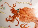 a picture of a vase with a dragon painted on it