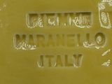 a close up of a sign on a yellow plate