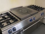 a stainless steel stove and oven in a kitchen