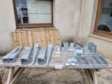 a wooden table with a lot of metal items on it