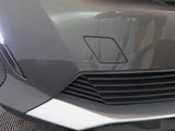 a close up view of a car ' s front grill