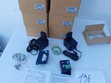 several boxes of electronic equipment sitting on top of a white table