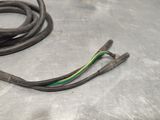 a wire that is laying on a metal surface