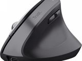 the wireless mouse is connected to a charger on a white surface