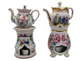 two teapots that are sitting on top of each other