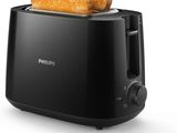 un gros plan d'un grille-pain contenant deux tranches de pain