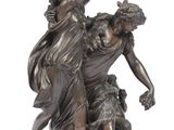 bronze statue of a woman and a child with a dog