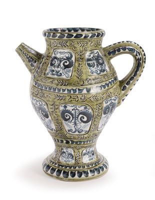 a vase that is sitting on a white surface