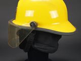a close up of a yellow hard hat on a mannequin head