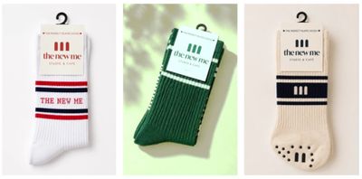 three pairs of men ' s socks hanging on a hanger