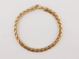a gold chain bracelet with a clasp