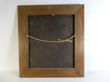an old wooden frame with a rope hanging from it ' s side