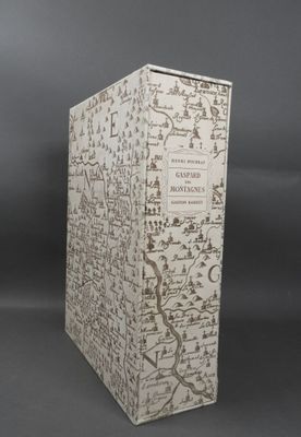 an old book with a map on it sitting on top of a table