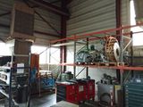 a picture of a garage with a lot of tools on the shelves