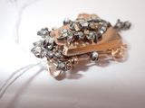 a gold brooch with a bunch of jewels on it