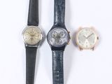 three different types of watches are displayed on a white surface