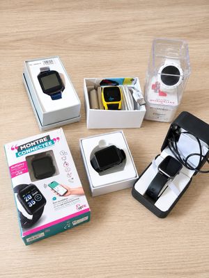 a box with a watch and a cell phone in it