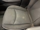 a dirty seat in a car that has been cleaned