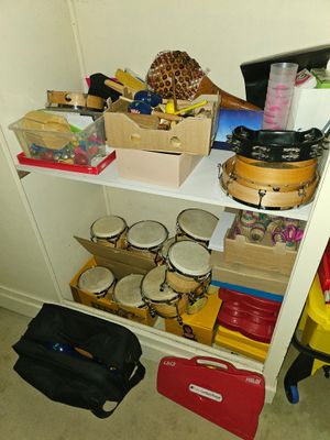a white shelf with many items on it in a room