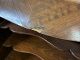 a wooden table with a mirror on top of it