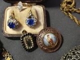 a lot of jewelry sitting on a table together