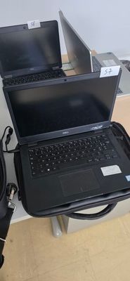 two laptops that are sitting on top of each other