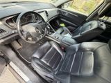 the interior of a car with black leather seats and a steering wheel