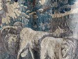 two sheep that are standing next to each other